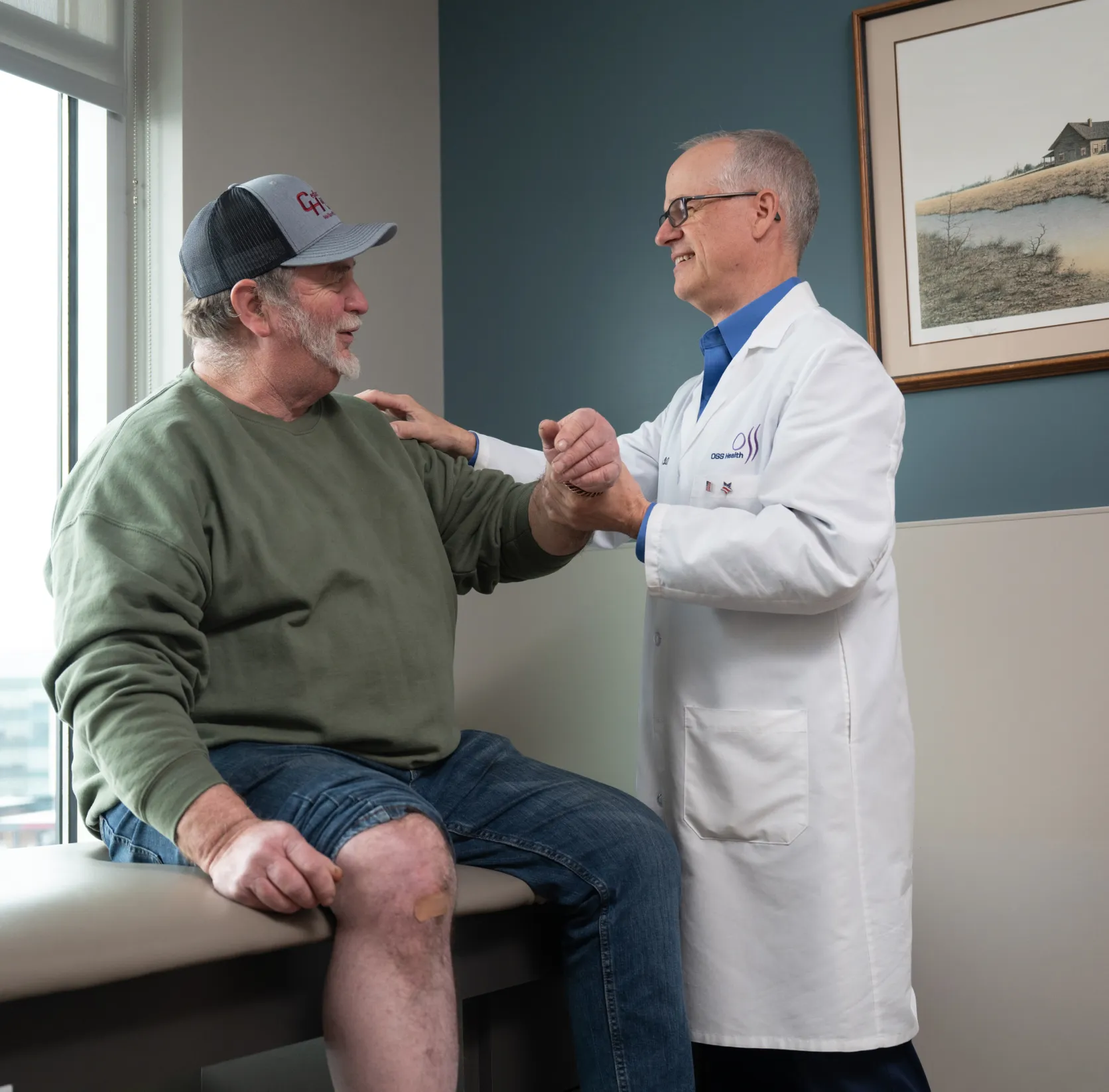 OSS Health physician examining a patient’s wrist